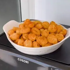 Ñoquis dorados y crujientes, recién salidos de la freidora de aire. ¡Una delicia fácil y rápida!